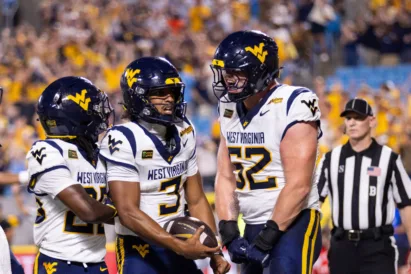 The Best Virginia: West Virginia runs roughshod over No. 25 Virginia 38-27 in Duke's Mayo Classic
